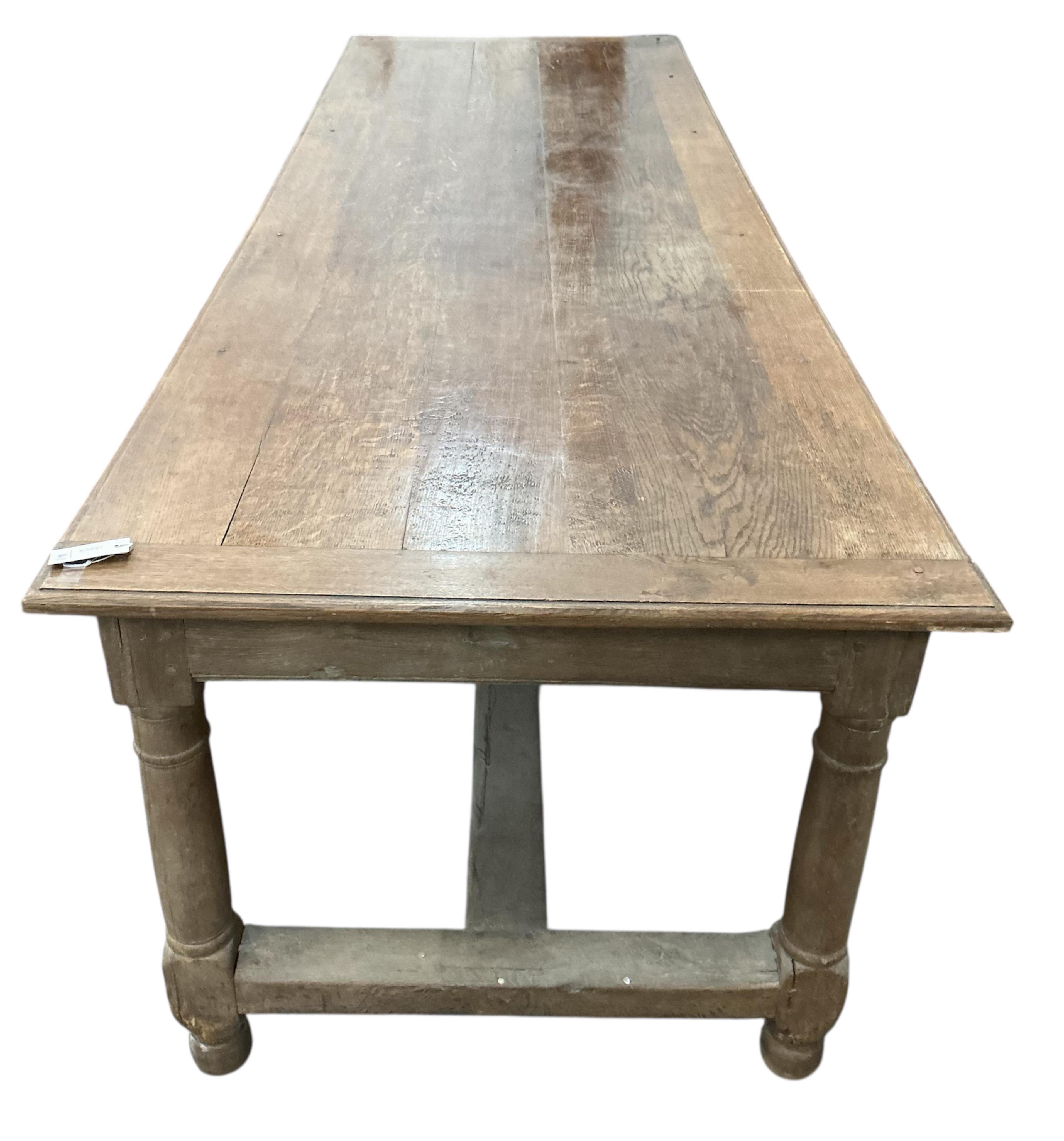 A late 19th century French oak rectangular refectory table, width 258cm, depth 88cm, height 75cm